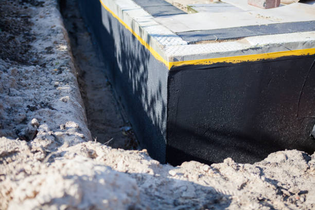 Professional Waterproofing technician working in Brant, MI